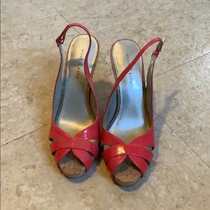 Coral patent leather sling back heels.